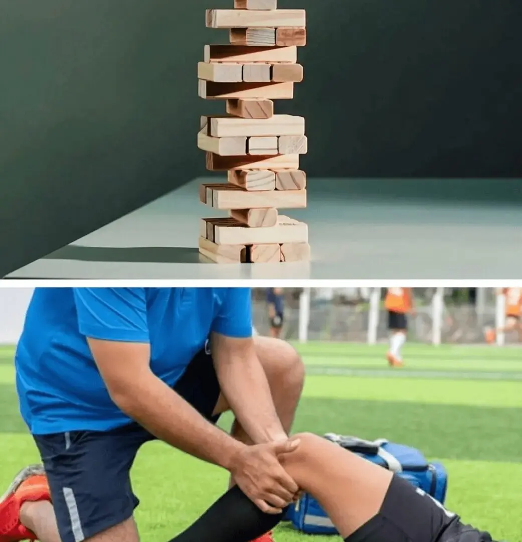 Stacked wooden blocks and athlete receiving leg treatment.