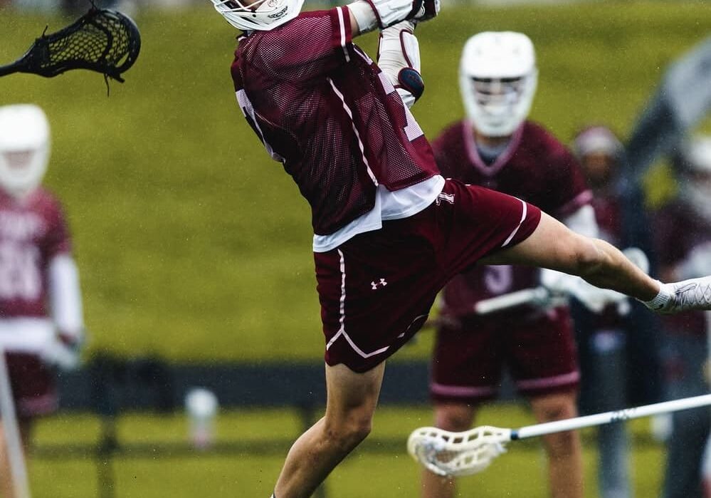Lacrosse player executing a powerful shot