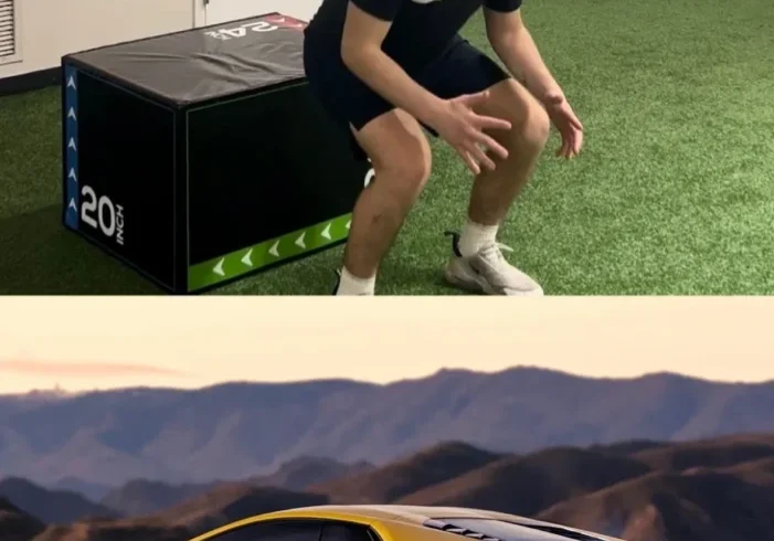 A man performing a box jump exercise indoors.